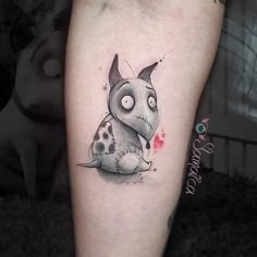 a small tattoo on the leg of a person with a dalmatian dog in it