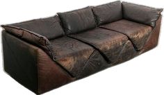 a brown leather couch sitting on top of a white floor