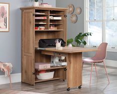 a wooden desk and chair in front of a bookcase with shelves on the side