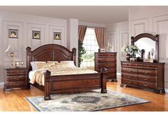 a bedroom scene with focus on the bed and dresser