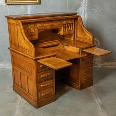 an old fashioned wooden desk with drawers