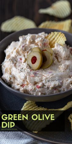 an image of a bowl of dip with crackers and apples on the side that says green olive dip