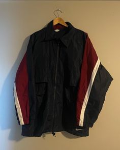 Vintage Nike windbreaker  - 90s vintage  - White tag  - Big swoosh back logo  - Bottom hemline swoosh front logo  - Striped sleeve  - Vented all around  Size: XL  Great vintage condition  No rips or holes  No stains Cheap Retro Windbreaker For Sports, 90s Style Sports Windbreaker For Fall, 90s Style Fall Sports Windbreaker, 90s Style Track Jacket With Pockets For Streetwear, Nike Windbreaker Outfit, Windbreaker Outfit, Vintage Nike Jacket, Nike Windbreaker Jacket, Vintage Nike Windbreaker