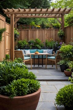 an outdoor seating area with potted plants and wooden pergols on either side