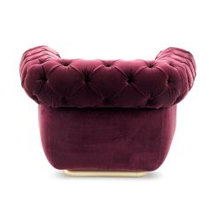 a purple velvet chair with gold legs and buttons on the back, against a white background