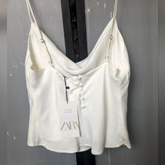 New W/ Tags Luxury Ivory Camisole. For Dressing Up. Size Sm See Measurements In Pics. Chic Buttoned Tank Top For Day Out, Elegant Summer Tank Top With Buttons, Elegant Spring Tank Top With Buttons, Chic Cami Tank Top With Button Closure, Elegant White Tank Top With Button Closure, White Buttoned Tank Top, Chic White Buttoned Tank Top, White Tank Top With Buttons, Spring Buttoned Camisole