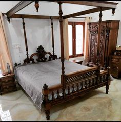 a large bed sitting in the middle of a bedroom