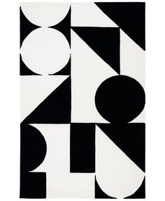 a black and white rug with geometric shapes