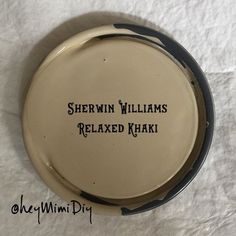 there is a small plate with the words shewin williams relaxed khaki on it