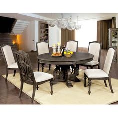 a dinning room table with chairs around it