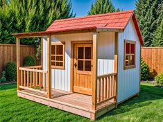 a small wooden shed sitting on top of a lush green field