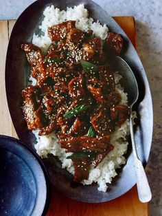 a plate with rice and meat on it