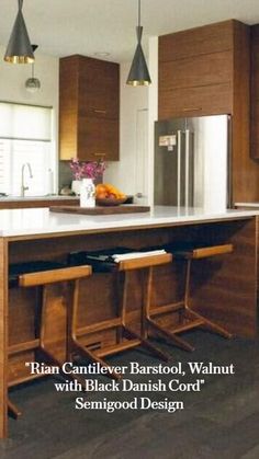 a kitchen island with stools in front of it and the words, ryan cantiler barstool walnut with black danish cord