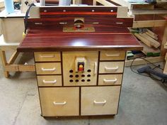 a workbench made out of wood with drawers and knobs on the top