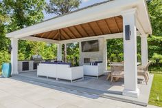 an outdoor kitchen and dining area is shown