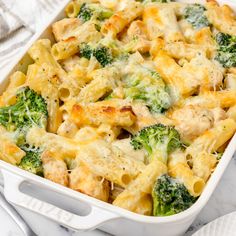 a casserole dish with broccoli and chicken in it on a table