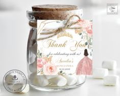 a jar filled with marshmallows and a thank card