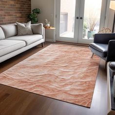 a living room filled with furniture and a large rug