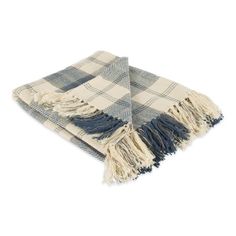 a blue and white checkered blanket with fringes on the ends is laying down