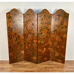 a room divider with flowers and leaves painted on it