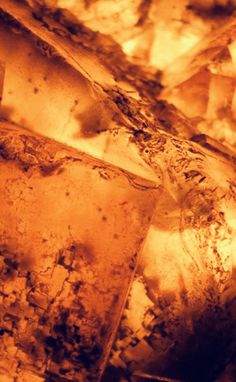 some ice cubes sitting on top of each other in an oven with yellow light