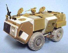 a toy army vehicle is shown on a blue background