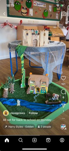 a play area with toys and decorations on the table for children to play in it