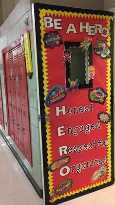 a bulletin board with the words be a hero on it in front of lockers