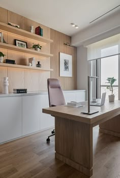 a wooden desk with a laptop on it