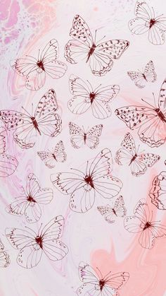 a bunch of butterflies flying in the air over a pink and white swirly background