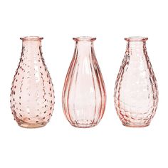 three glass vases sitting next to each other on a white surface with dots in them