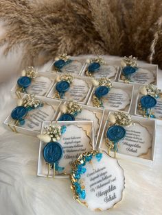 blue and white wedding favors with gold accents on display for guests to sign in the reception room