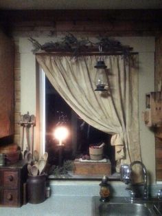 a kitchen with a sink, window and hanging lights in it's windowsill