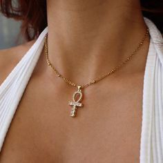 Ankh Necklace, Egyptian Jewelry, Spiritual Jewelry for Her, Meaningful Jewelry, Cubic Zirconia Necklace, Gift for Her, Egyptian Necklace ☽ 24K Gold Plated, Cubic Zirconia Charm (19.7x13.3mm) ☽ This is a gold plated charm meaning that it requires extra care to keep its shine and color intact. Please follow these tips to make the charm last longer in its original condition: avoid wearing it to the beach, pool, shower, bathtub, hot tub; avoid it touching any lotions, creams, or sweat; take it off b Gold Ankh Necklace, Ankh Jewelry, Egyptian Inspired Jewelry, Jewelry Spiritual, Egypt Jewelry, Dope Jewelry Accessories, Shower Bathtub, Egyptian Necklace, Ankh Necklace