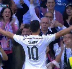 the soccer player is celebrating his team's victory in front of an excited crowd