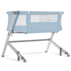 a blue baby crib with wheels on it