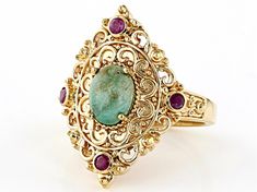 This stunning piece, the 8x6mm LaBonita Turquoise & 0.16ctw Indian Ruby 18K Yellow Gold Over Sterling Silver Ring from our Artisan Collection of India™, is a true treasure to behold! Picture this: a dreamy oval-cut turquoise gemstone resting gracefully beside four vibrant round Indian ruby stones on an intricate band of shimmering gold and silver. The playful mix of colors creates an eye-catching contrast that will surely turn heads wherever you go.  The ring's design features precise measur Antique Indian Rings, Ruby Stone, Picture This, Turquoise Gemstone, Gold And Silver, Oval Cut, Sterling Silver Ring, Ring Designs, Design Features