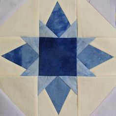 a blue and white patchwork design on a piece of cloth