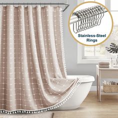 a bathroom with a bathtub and shower curtain that has rings attached to the rod