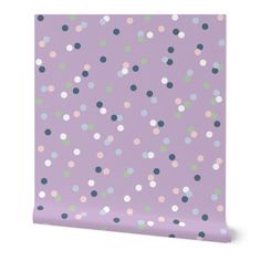 a purple wallpaper with multicolored polka dot dots on it's surface