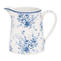 a blue and white flowered pitcher on a white background, with the handle extended