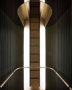 an escalator in a public building with sunlight coming through the windows