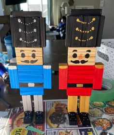 two wooden nutcrackers sitting on top of a table