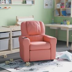 a pink recliner chair sitting in a child's room