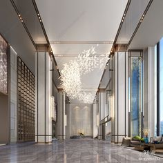 an empty lobby with chandelier and couches in the middle, surrounded by large windows