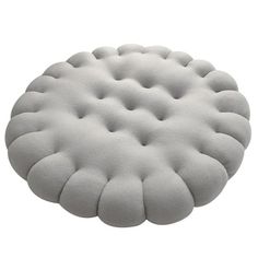 a white round cushion on a white background