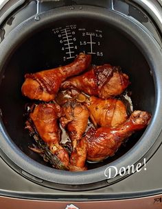 some chicken in an air fryer with the words done