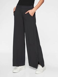 Athleta Gramercy Track Trouser Black (FIRST PICTURE) SIZE 6 #376009 EXCELLENT USED CONDITION $108.00 FIT & SIZING Semi-fitted, Mid rise Wide through the thigh and leg for an easy fit, Sits at the natural waist Inseam: Regular: 30" Petite: 28" Tall: 33" PRODUCT DETAILS FOR: Commuting in, working at the office, and travel  FEEL: Recycled Featherweight Stretch™ fabric feels sleek and light as air   FAVE: Side snaps along the leg to adjust your fit and styling Back zip pockets secure your essentials Work And Travel, Travel Pants, Work Pants, Trouser Pants, Picture Sizes, Cropped Pants, Fabric Care, Track Pants, Black Pants