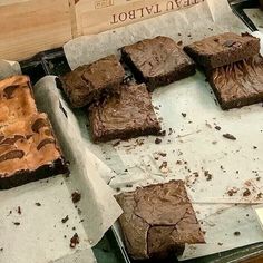 there are many brownies on the tray