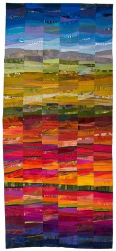 a multicolored patchwork quilt with many different colors